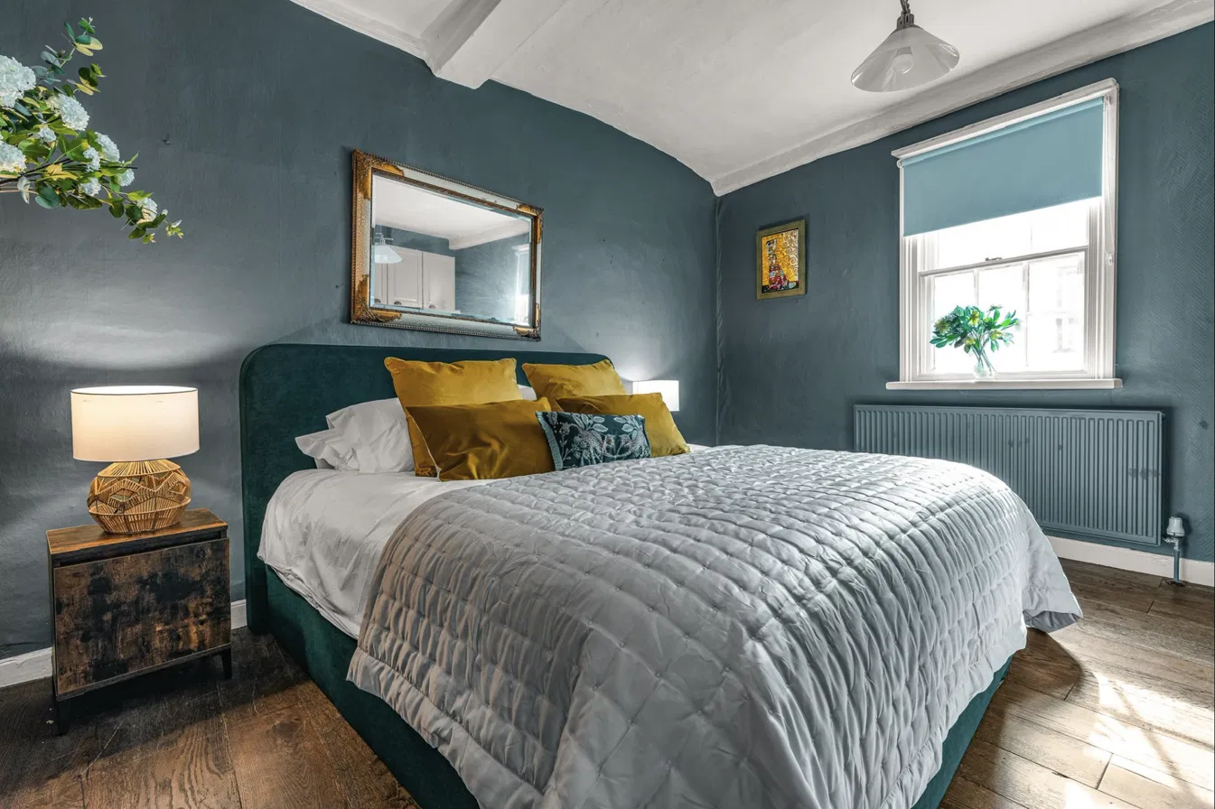 Characterful teal double bedroom in a Hertford short-let