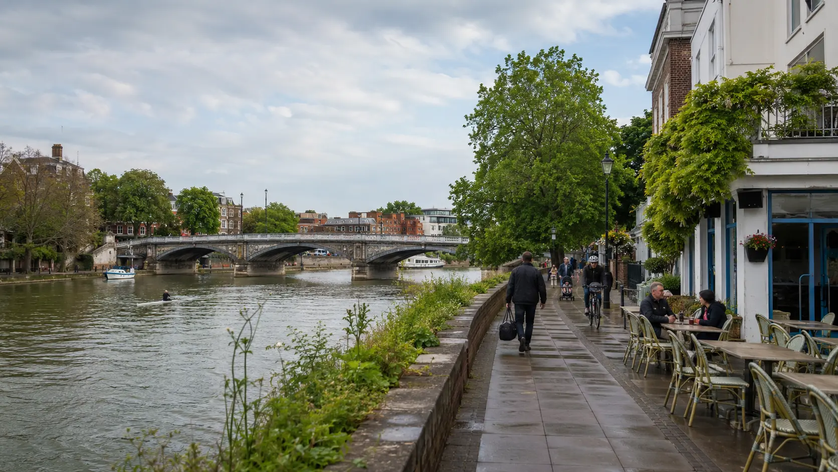 Maidenhead Bridge crossing the River Thames with riverside cafes.
