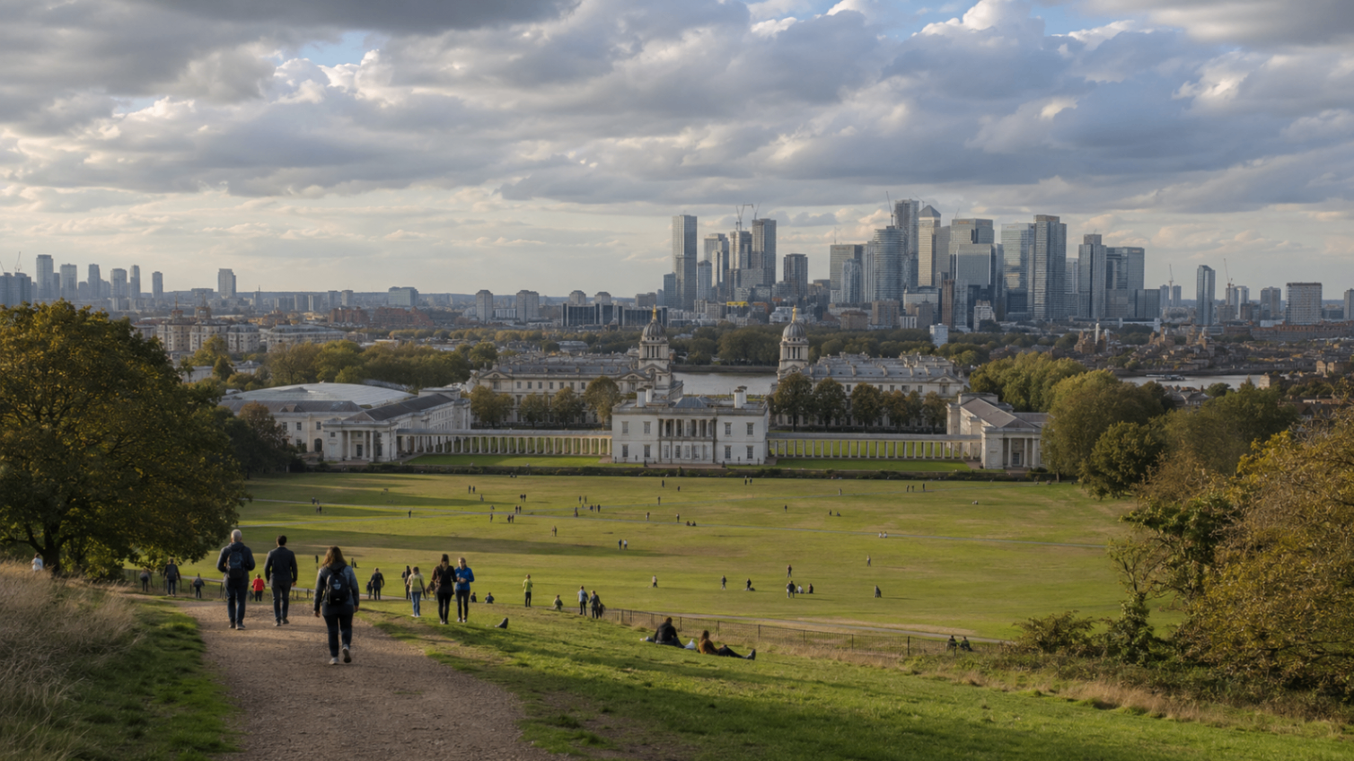 View from Greenwich Park across the Old Royal Naval College toward the Canary Wharf skyline, London.