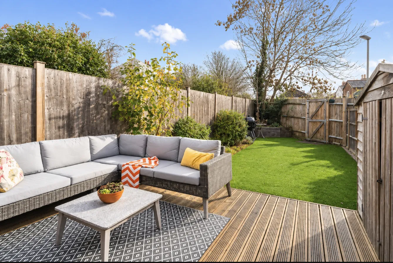 Landscaped rear garden and decked seating area of a Hertford property