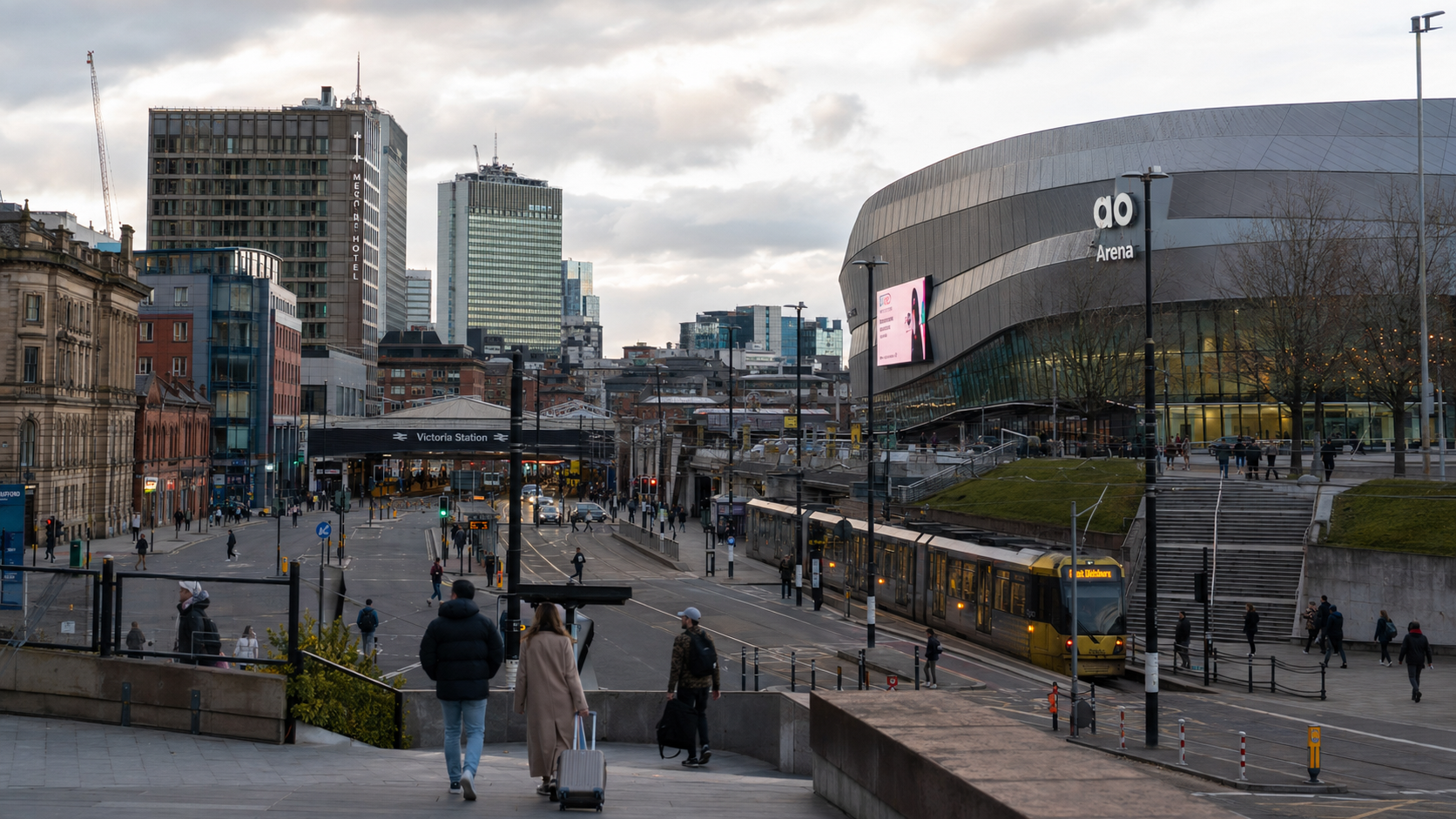 AO Arena, Victoria Station and a Metrolink tram in Manchester city centre.