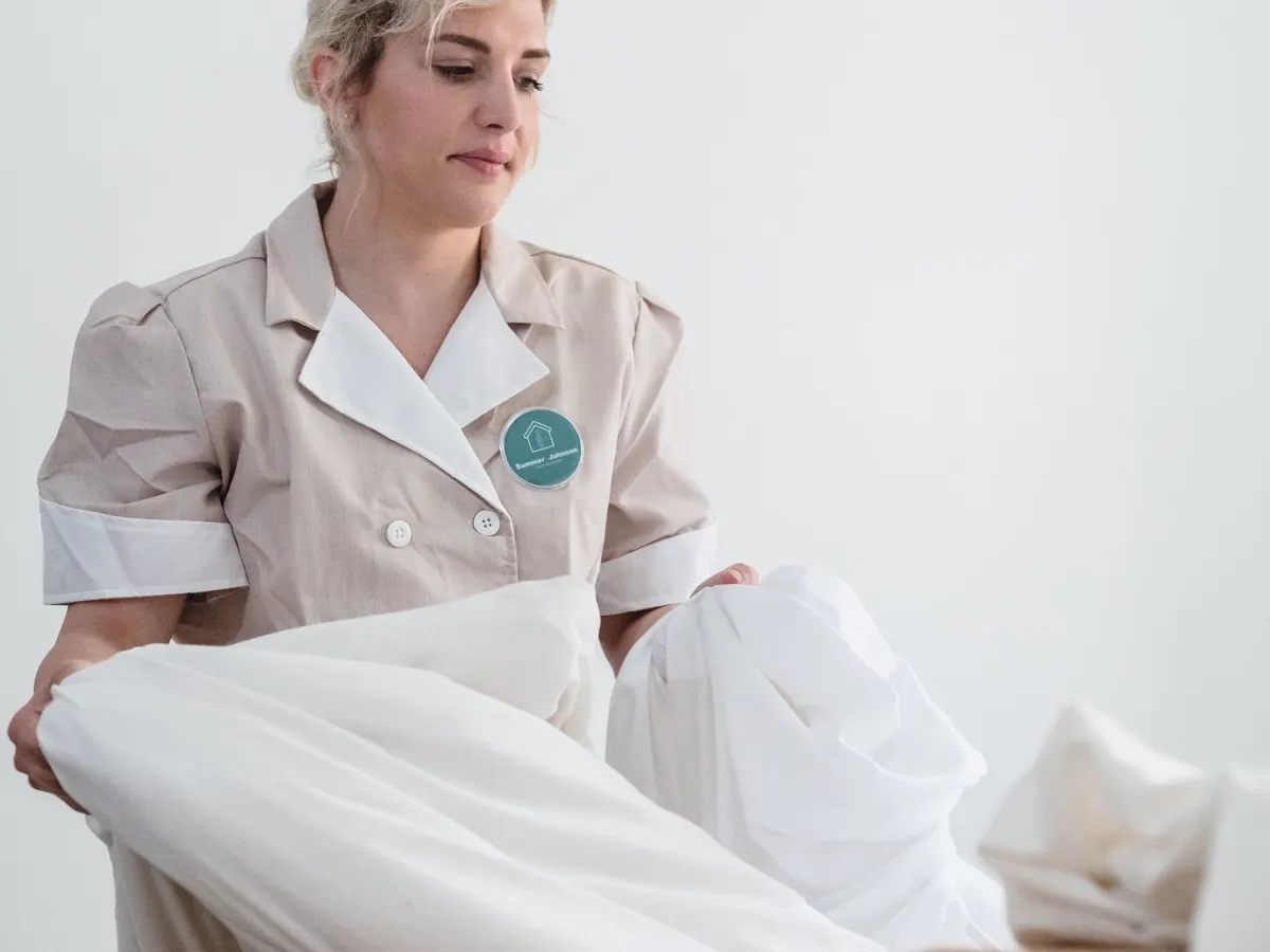 Fresh bed linen being prepared during a changeover