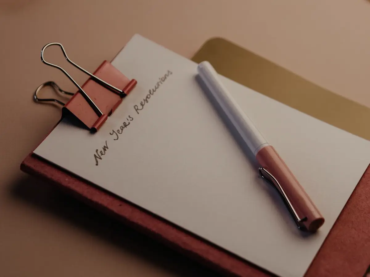 A notebook and pen on a desk